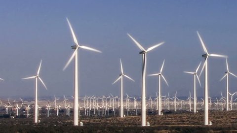 Hundreds of windmills turn in the California desert.