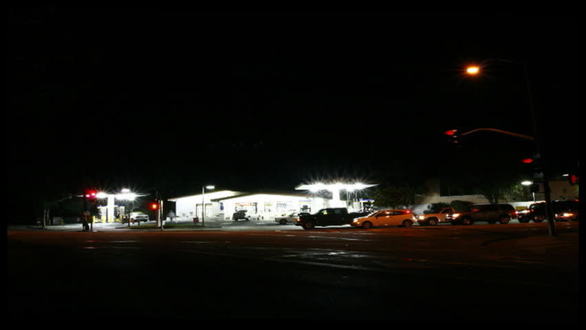 Time-lapse shot of a gas station with zoom in.