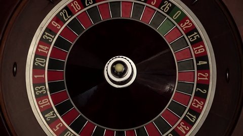Croupier spins the classic roulette, quickly, white ball