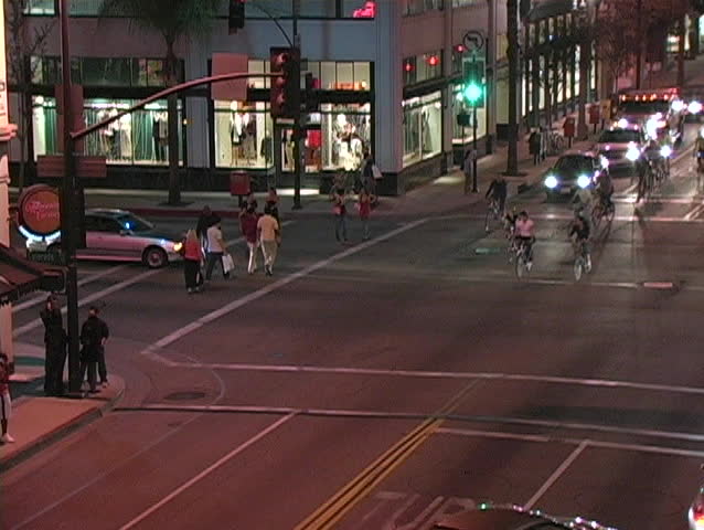 Bicyclists ride into an intersection in LA as if they own the road.