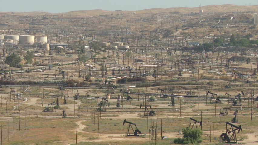 Camera pans across a vast oil field in Bakersfield, California