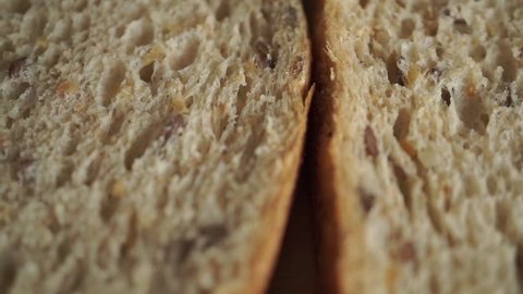 Bread slices on cutting board macro dolly video