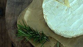 Portion of rotating creamy Camembert as detailed 4k footage (not seamless loopable)