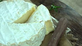 Portion of rotating creamy Camembert as detailed 4k footage (seamless loopable)
