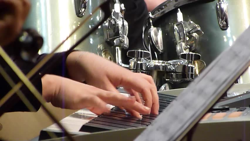 Piano player with synthesizer in action | Shutterstock HD Video #14107430
