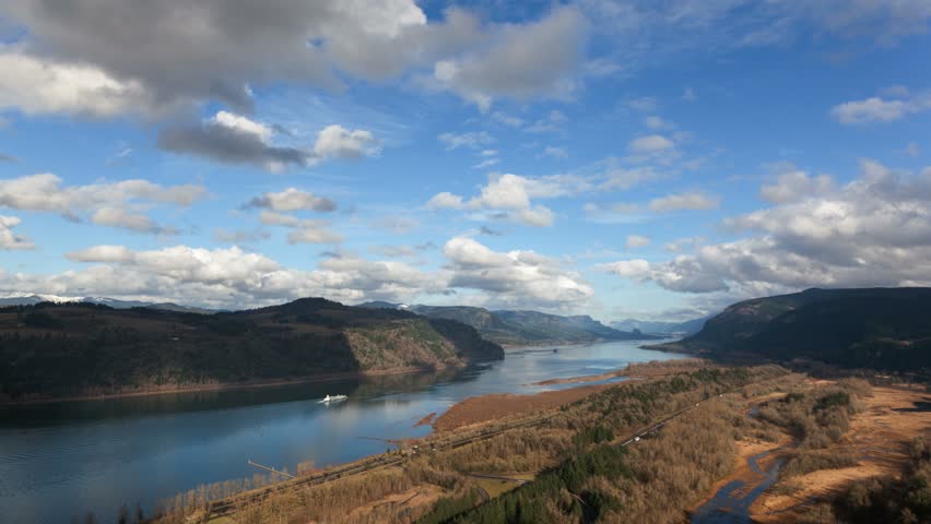 UHD 4k Time Lapse Movie of fast moving white clouds over Columbia River Gorge in Portland Oregon one winter afternoon 4096x2304