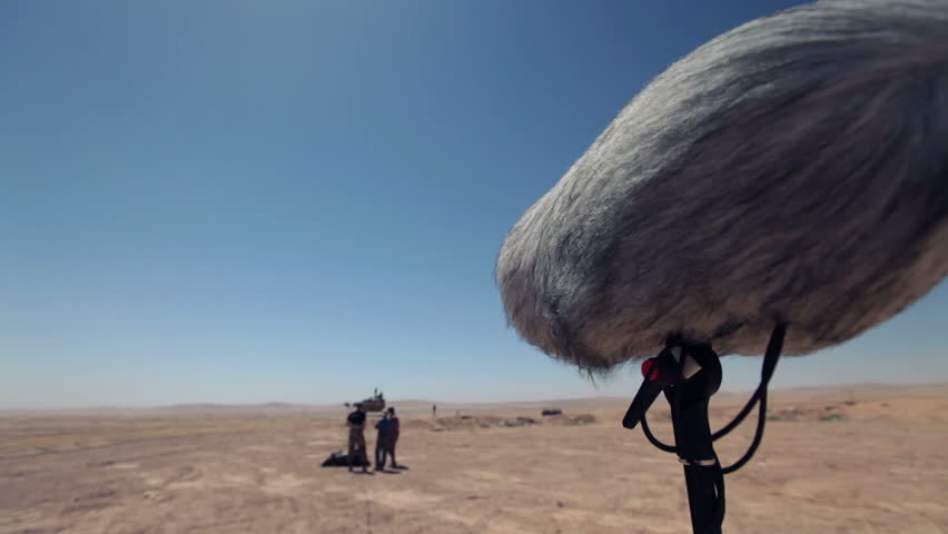 Shooting movies. A microphone to record sound.