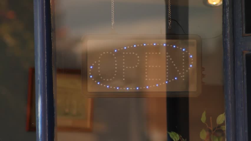 Open Sign Lit Up in Shop Window