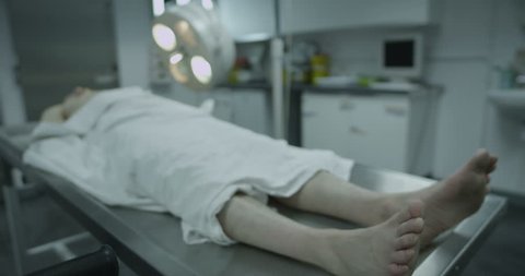 4k / Ultra HD version Dead male body laid out on an autopsy table Shot on RED Epic