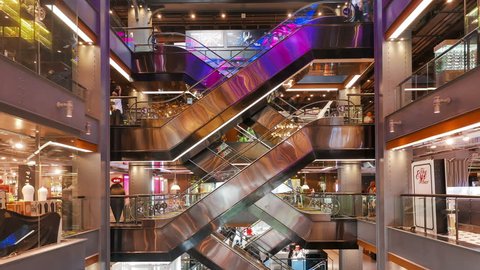 BANGKOK / THAILAND - JAN 27 2016 : Time-Lapse of People using the escalators in Siam Center Shopping Mall Bangkok.