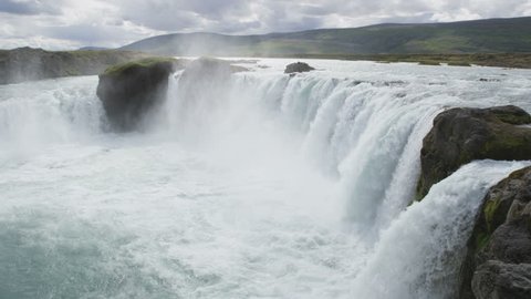 Iceland waterfall. Idyllic view of beautiful Godafoss waterfall. It is a spectacular Icelandic waterfall on the North of island. It is one of the famous tourist attractions. SLOW MOTION