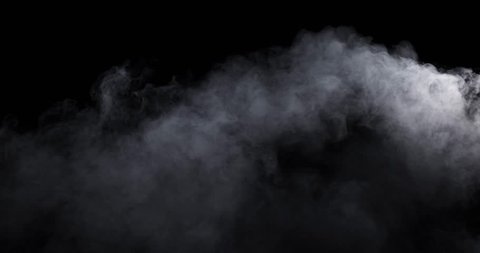 Smoke - 4K - long. Medium dense smoke over a black background. Totally appearing from the bottom and filling the lower part of the frame. 120 fps Real shot