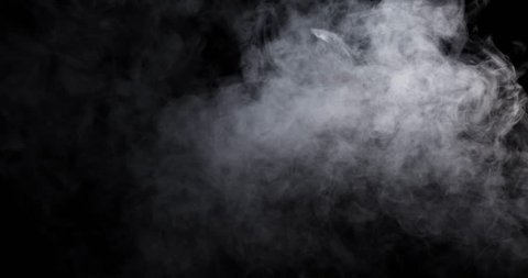 Smoke - 4K - long. Dense smoke over a black background. Totally appearing from the bottom and disappearing. 120 fps Real shot