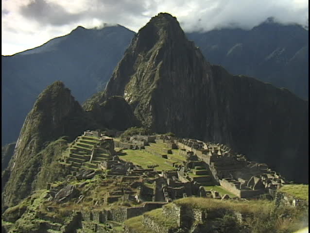 The ancient ruins of Machu Picchu lie in the mountain hillsides of Peru.