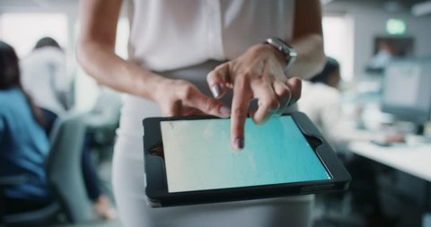 Business woman using digital tablet touchscreen display manipulating 3d shape