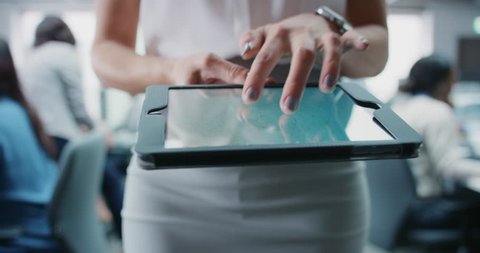 Business woman using digital tablet touchscreen display manipulating 3d shape