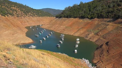 OROVILLE LAKE, CALIFORNIA - CIRCA 2015 - Houseboats sit in low water at Oroville Lake in California during extreme drought.
