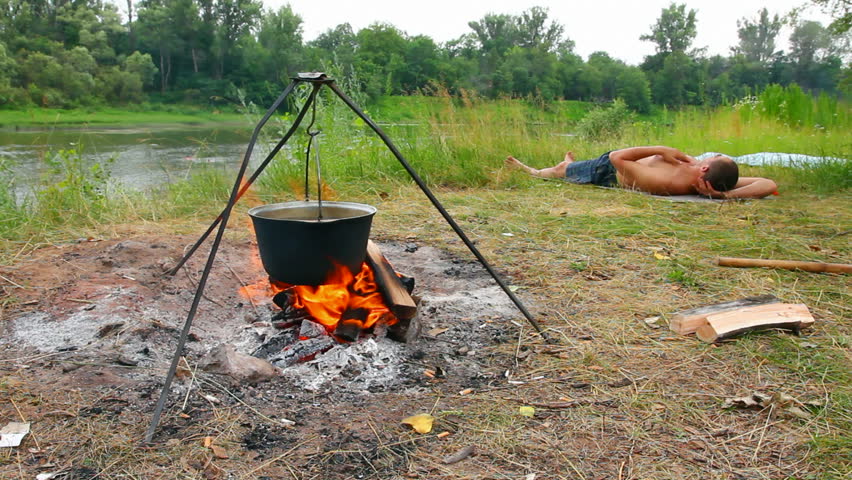 camping - kettle over campfire