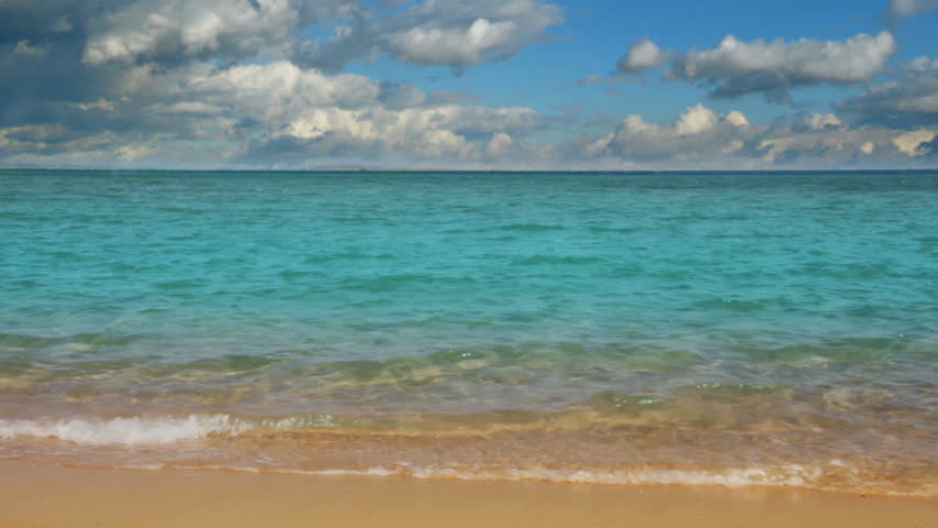 landscape with turquoise sea and golden sand beach