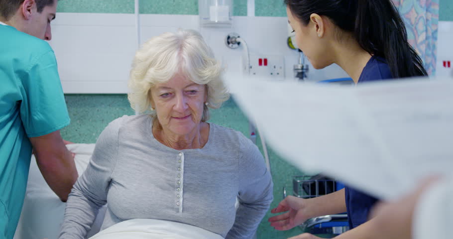 4k / Ultra HD version Attractive young nurse taking care of an elderly female patient and checking her blood pressure. In slow motion. Shot on RED Epic | Shutterstock HD Video #14147753
