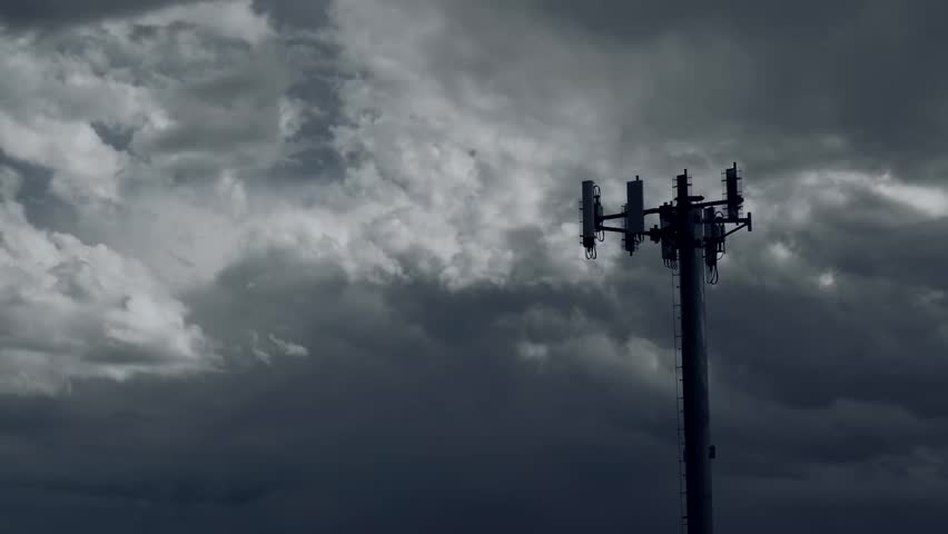 Storm clouds gather over an antenna 