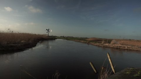 Little polder mill at the end of a river.
