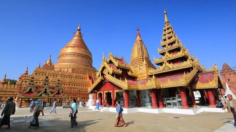 BAGAN, MYANMAR - DECEMBER 8, 2015 : Traveler and Burmese people come to Shwezigon Pagoda at Bagan Archaeological Zone on December 8, 2015 in Bagan, Myanmar 