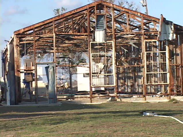 Medium shot of the frame of a house stripped bare by Hurricane Katrina. | Shutterstock HD Video #1416175
