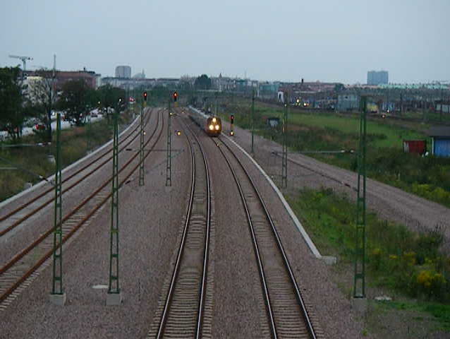 Train passing under bridge