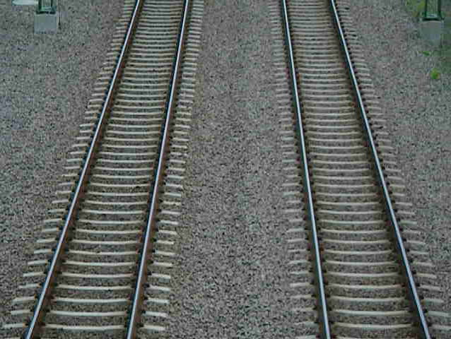Train passing under bridge