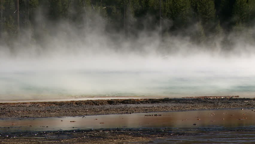 Steam blows over Grand Prismatic Spring in Yellowstone National Park