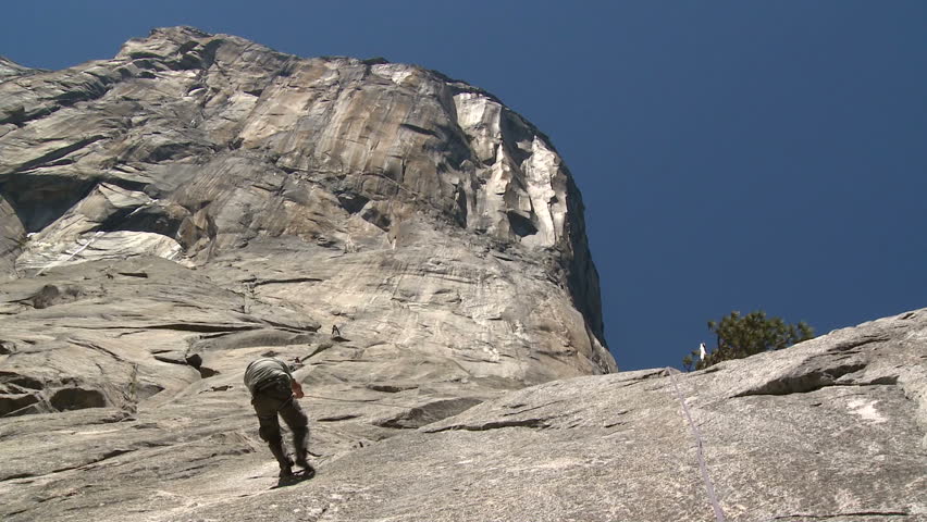 Climber walks down first pitch of El Capitan in Yosemite