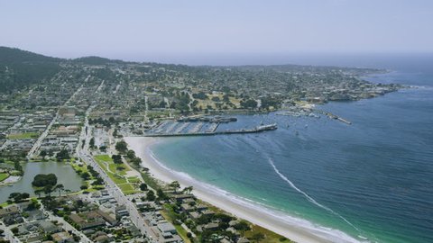 4k / Ultra HD version Aerial view of Monterey bay city on Californian coast along the Big Sur. USA homes line the cliffs overlooking the blue ocean. Shot on RED Epic