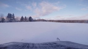 Fast Snowmobile Dash Camera Video during Sunset in Powder Snow.
