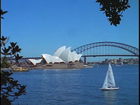 The Sydney Opera House and Bridge are situated on Bennelong Point in Sydney Harbor.