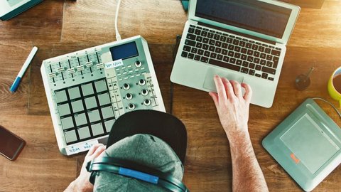 Music Producer / DJ working with his Drum Machine / mixer - flat lay over head shot Stock Video