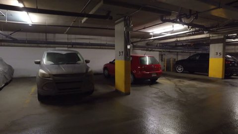 MONTREAL, CANADA - January 2016: A Building's Sub-terrain Garage (Smooth Steady-Cam Shot)