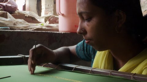 Baruipur, India - CIRCA 2013 - Indian women embroidering fabric