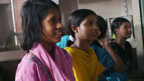Baruipur, India - CIRCA 2013 - Girls looking around and then at camera