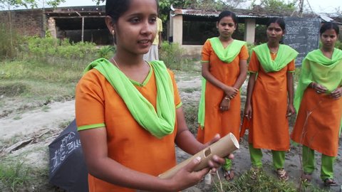 Baruipur, India - CIRCA 2013 - Girls teaching about natural herbicides
