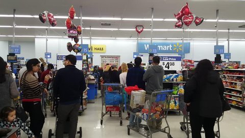 MOUNTAIN VIEW, CA/USA - JANUARY 24: People shopping at Walmart supermarket store in Mountain View, CA on Jan 24, 2016. It is an American multinational retail corporation.