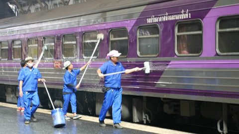 Bangkok, Thailand – January 16, 2016: People clean the train after the passengers left at Hualampong Station. It is the main train station in Bangkok that passengers used to travel around the country.