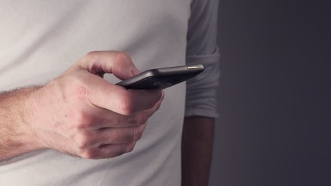Man using smartphone, male hands with mobile phone.