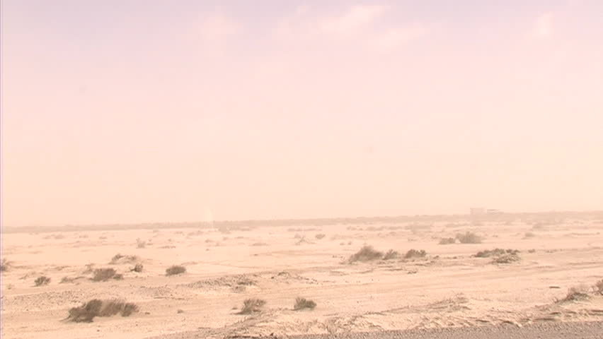 A dust storm rages in the desert.