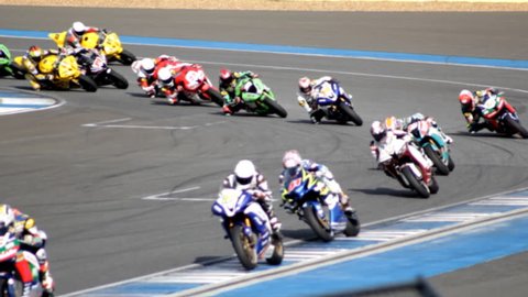 Motorcycles racing super sport bikes at track