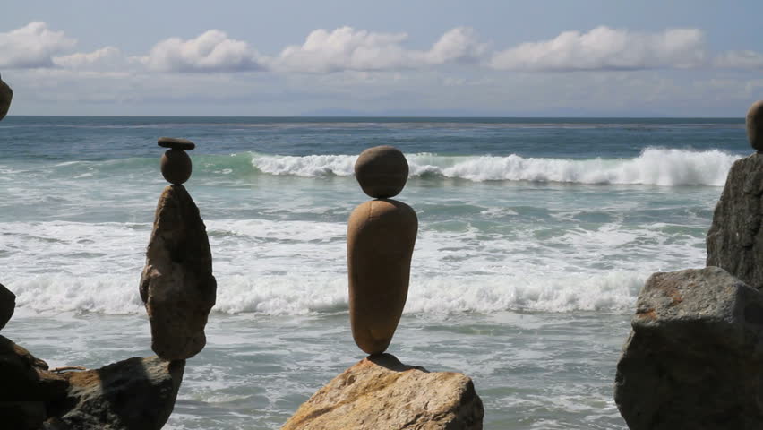 CU static shot of balanced rocks near beach