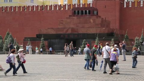 MOSCOW, RUSSIA – August 17, 2015: The Lenin mausoleum. People walk in Red Square near the mausoleum