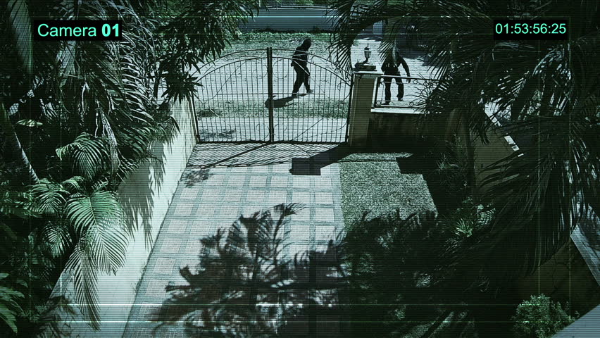 Real surveillance cameras captured and recorded the two robbers enter the house. Royalty-Free Stock Footage #14225156