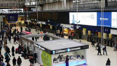 LONDON, UNITED KINGDOM – 22 JANUARY 2016: Timelapse of inside view of Waterloo Station, since 1848, central London railway terminus, busiest railway terminus, served 100 million passengers a year
