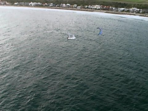 Aerial shot of kiteboarder getting air